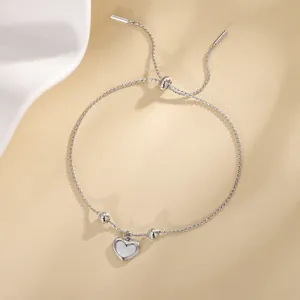 Elegant silver-toned heart shell pendant bracelet with adjustable bead drawstring