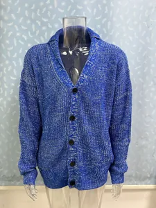 Detail shot of a blue and white marled knit men's cardigan with five black buttons.