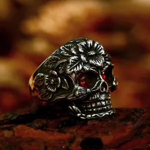 Vintage silver skull ring for men with rose engravings and red gemstone eyes
