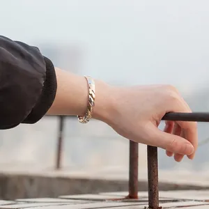 Three-tone twisted magnetic copper bangle with adjustable open design for men and women.