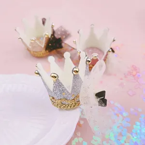 Detailed view of sparkly glitter crown hair clips for girls birthday party and performance