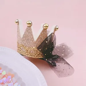 Glittery pink crown hair clip with a delicate black mesh bow for girls' parties.