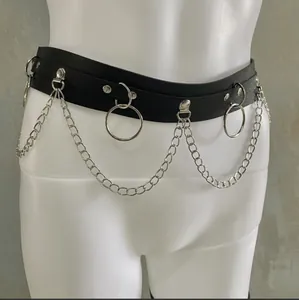 Detail view of black leather waist chain with silver rings and hanging chains.