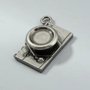 Detail view of antique silver finished vintage camera pendant for DIY jewelry