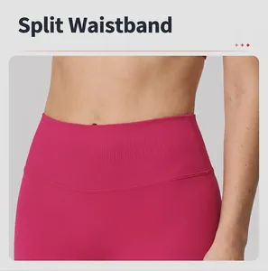 Detailed macro view of the wide high-waisted compression band on seamless pink yoga leggings.