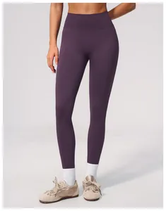 Detailed view of seamless high-waist yoga pants in deep purple with a soft finish