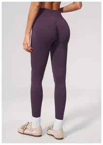 Back view of high-waist seamless purple yoga pants with butt lifting detail.