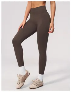 High-waisted seamless dark brown yoga leggings featuring a flattering peach butt lift effect
