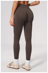 Back view of seamless high-waisted yoga leggings with scrunch butt detail in coffee brown