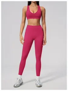 Women's two-piece seamless yoga set with high waist leggings and sports bra in fuchsia