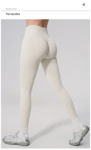 Back view of seamless high-waisted peach butt lifting yoga pants in terracotta color