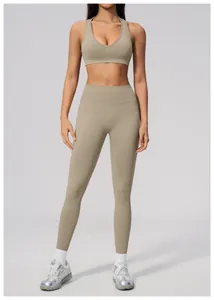 Full front view of women's seamless yoga set in beige worn by an athletic model