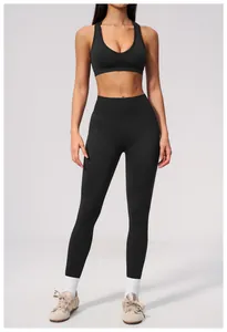 Professional black seamless high waist yoga leggings and matching sports bra gym set.