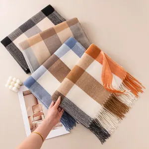 Soft and cozy cashmere-like plaid scarves in assorted autumn colors with tassels