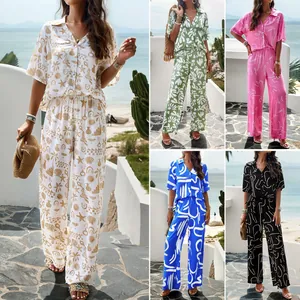 Elegant women's two-piece set featuring printed short sleeve shirt and wide-leg pants