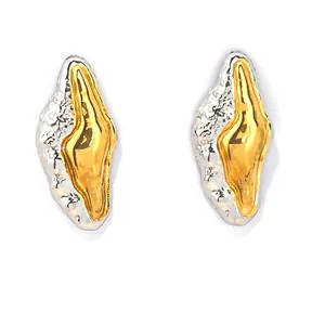 Minimalist lava textured gold and silver two-tone stud earrings for niche designer style