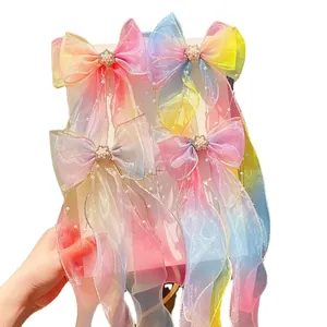 Vibrant rainbow organza bow hair clips with elegant long ribbons and pearls for girls