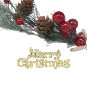 Gold Merry Christmas tree ornament with pine needles and red berries