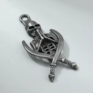 Macro view of vintage antique silver skeleton pendant featuring crossed scimitars