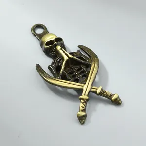 Close-up of vintage bronze alloy skeleton and crossed scimitars pendant for jewelry