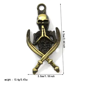 Antique bronze skull pendant with crossed swords showing size and weight for DIY jewelry