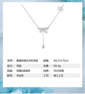 Detail view of S925 sterling silver bowknot necklace with zircon tassel pendant