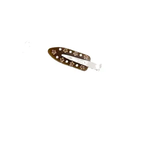 French style brown acetate hair clip with floral rhinestone inlay on white background