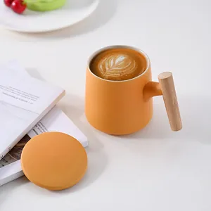 Minimalist matte orange ceramic mug with wooden handle and matching lid