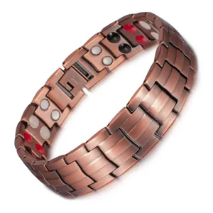 Close-up detail of men's magnetic red copper bracelet with energy stones on the inner band