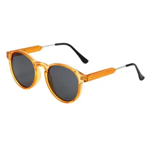 Stylish retro round sunglasses with translucent orange frames and dark lenses