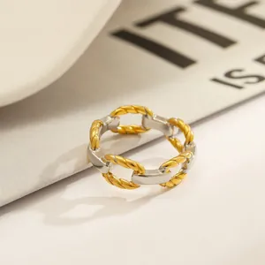 Detailed view of a minimalist two-tone 18k gold-plated stainless steel chain link ring.
