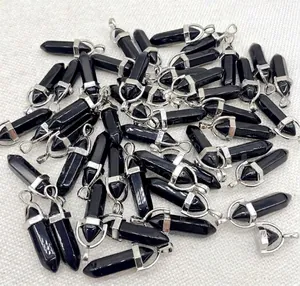 Detailed overhead view of multiple natural black onyx hexagonal crystal pendants