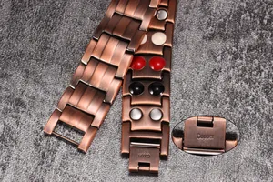 Detail view of men's red copper magnetic bracelet with material engraving and magnets