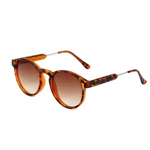 Detail shot of retro tortoiseshell fashion sunglasses with brown gradient lenses