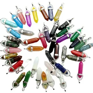Assorted hexagonal pointed natural crystal stone pendants in many vibrant colors.