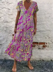 Detail view of a purple V-neck maxi dress with yellow floral pattern for a boho look.