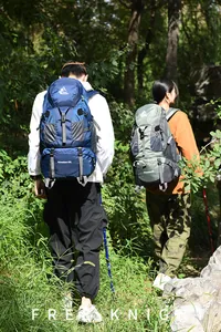 Outdoor enthusiasts hiking with large Free Knight adventure backpacks in a forest