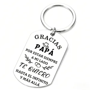 Stainless steel dog tag keychain engraved with Spanish Papa quote on a pure white background