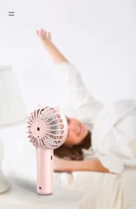 Portable pink handheld mini fan with cat ear design for bedside use