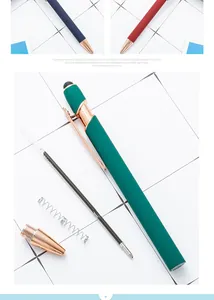 Detail view of disassembled rose gold metal stylus ballpoint pen with ink refill.