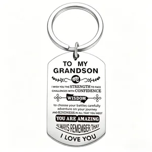 Close-up of engraved inspirational message to grandson on stainless steel keychain