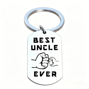 Detailed macro view of a stainless steel keychain engraved with Best Uncle Ever text.