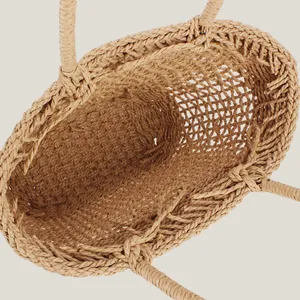 Handmade hollow-out woven straw tote bag for casual beach vacation and daily use