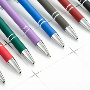 Multi-color metal retractable ballpoint pens with touch stylus tips on white tile.