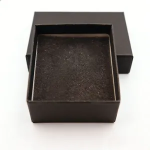 Close-up of a minimalist black cardboard gift box with a soft sponge insert for jewelry