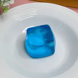 Blue translucent ice cube squishy toy with realistic maltose jelly texture