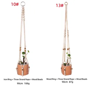 Detailed view of hand-woven cotton rope plant hangers with wooden beads and ring