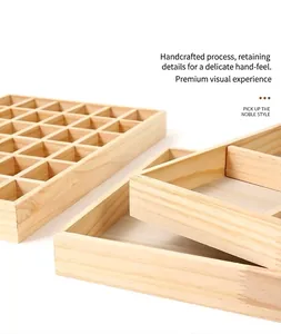 Close-up detail of solid wood jewelry display tray with multi-grid compartments.