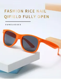 Close-up detail of vintage classic orange sunglasses featuring elegant rice nail decoration