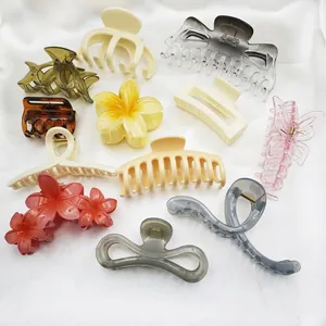 Collection of various elegant hair claw clips in floral and geometric shapes for women